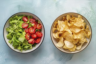 Comparison of healthy and unhealthy food with potato chips on one side and salad on other side.