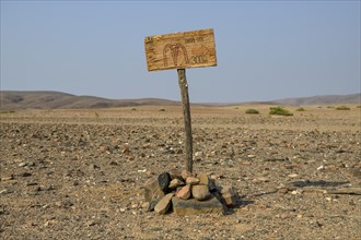 Homemade sign Mc Doland's Drive in the middle of the desert, near Sanitatis, Khumib dry river,