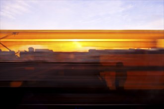 Long exposure from a moving train at sunrise, Hagen, North Rhine-Westphalia, Germany, Europe