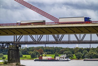 The Beeckerwerth Rhine bridge of the A42 motorway, truck traffic, behind it the Haus-Knipp railway