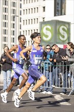 Dejene Megersa Ethiopia and Yohei Ikeda Japan on Potsdamer Platz at the 50th BMW Berlin Marathon