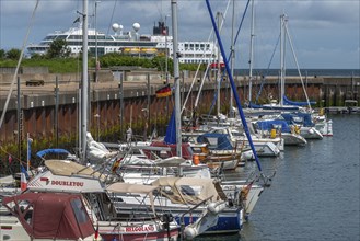 Sailing yachts in the north-east harbour, passenger ship MS Maud of Hurtigruten AS, offshore island