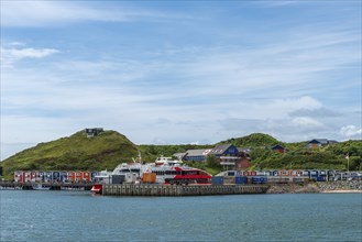 View from the Binnenreede to the inland harbour with the high-speed catamaran Halunder Jet,