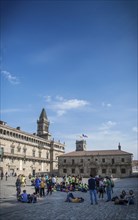 Tourists at old town landmark Obradoiro Square near santiago de compostela cathedral spain