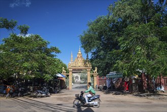 Wat damnak temple door and street in central urban siem reap city cambodia