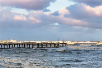 Pier in the sea, evening seascape, dawn hour on the sea