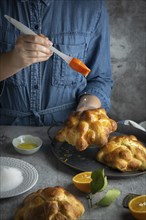 Food Photography, Woman preparing Pan de muertos bread of the dead for Mexican day of the dead