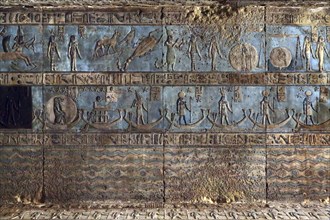 Hieroglyphic carvings and paintings on the interior walls of an ancient egyptian temple in Dendera