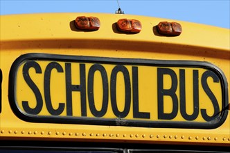 The front of a yellow school bus