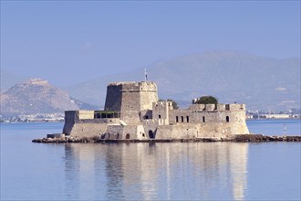 The castle of Bourtzi in the bay of Nafplio, Greece, Europe