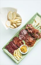 Spanish serrano ham chorizo sausage and cheese tapas snack platter