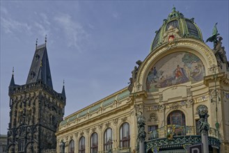 Ornate Smetana hall with a mosaic and a 15th gothic tower in Prague under a clear blue sky, Prague,