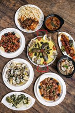 Mixed portuguese traditional rustic tapas food gourmet selection on wood table