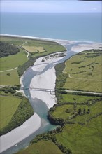 Bridge over a small river near the sea, West Cost, South Island, New Zealand, Oceania