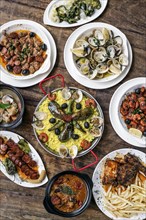 Mixed portuguese traditional rustic tapas famous food selection on wood table