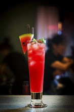 Fresh watermelon juice and vodka mixed cocktail drink at bar at night4