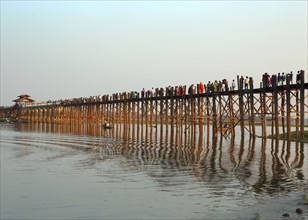 Famous U-Bein teak bridge at sunset on Taungthaman lake in Amarapura, Mandalay division, Myanmar,