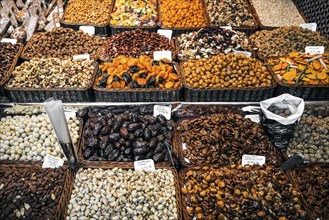 Dried fruits and nuts deli stall display at la boqueria market in barcelona spain