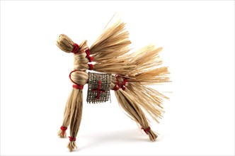 Traditional Russian toy, horse of the bast over white