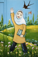 Mural of iranian muslim veiled schoolgirl in yazd iran