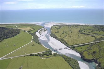 Bridge over a small river near the sea, West Cost, South Island, New Zealand, Oceania