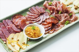 Spanish serrano ham chorizo sausage smoked meats cheese tapas sharing platter set with bread