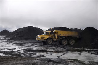 Westport, New Zealand, circa 2009: Coal truck dumps 70 ton load in stockpile at Stockton Coal Mine,