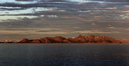 Panoramic view of the mountains on the Norwegian Sea coast at sunrise