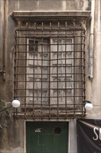 Barred window of a residential building in the historic centre, Genoa, Italy, Europe