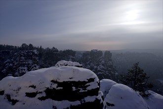 Bastei rock at full moon in winter