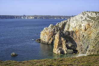 Natural arch in sea cliff along the Iroise Sea at the Pointe de Dinan, Cap de la Chèvre on the