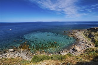 Super wide angle, pebble beach, few bathers, boat, green sea, blue sea, Favignana, Levanzo,