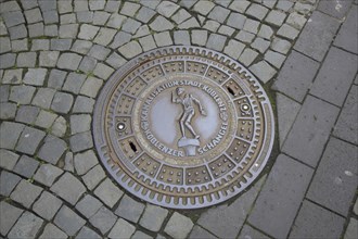 Manhole cover with landmark Schängel and inscription, floor, paving stones, Florinsmarkt, Old Town,