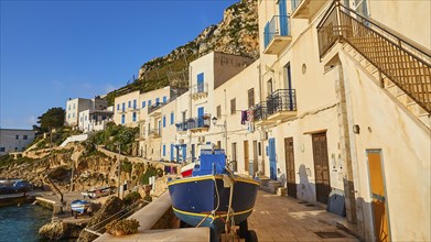 Morning light, row of houses, colourful houses, boat, Levanzo town, main town, Levanzo, Egadi