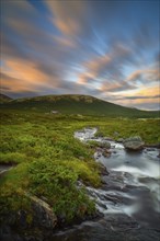 River and fjell hut, near lake Savalen, long exposure, landscape shot, evening mood, sunset,