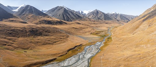 Aerial view, Burkhan mountain valley with meandering river, barren dramatic mountain landscape,