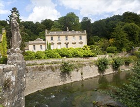 Statue of Britannia on the fifteenth century bridge over the River Frome, Iford Manor, near