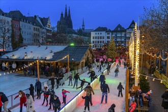 Ice rink at the Christmas market on the Heumarkt in the old town of Cologne, Cologne Cathedral,