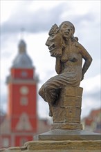 Sculpture Fides by Bernd Göbel 2021 with blurred Old Town Hall, historical, allegory, Roman,