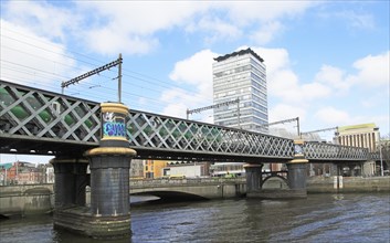 Loopline rail bridge or Liffey viaduct spanning river from Pearse railway station, Dublin, Ireland,