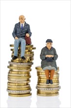 Pensioner and pensioner sitting on a pile of money, studio