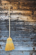 Broom on a wooden wall, hanging, cleanliness, purity, hut, detail, rural, tradition, decoration,