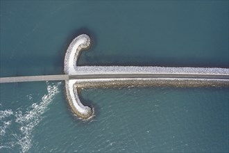 Aerial view over Sword bridge in winter, road bridge over Kolgrafafjörður in the north of the