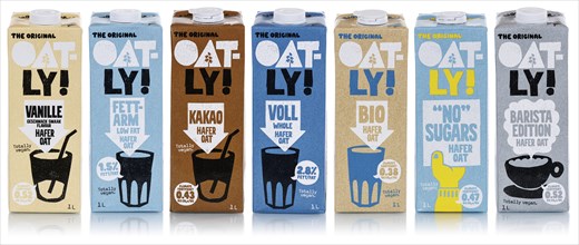 Oatly different types of vegan oat milk cropped against a white background