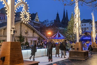 Ice rink at the Christmas market on the Heumarkt in the old town of Cologne, Cologne Cathedral,