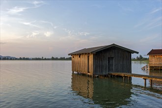 Boat huts with wooden jetty, sunset at Lake Kochel near Kochel am See, Bavarian Alpine foothills,