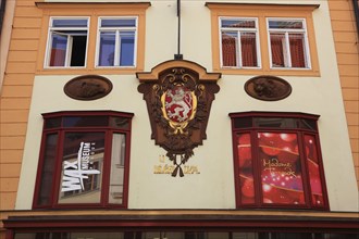 Historic house facade with coat of arms in the Old Town, Prague, Czech Republic, Europe