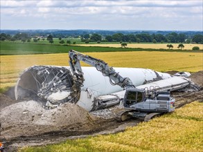 Demolished tower of a 20 year old wind turbine, in the Werl wind farm, 5 old Enercon E-66 turbines