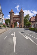 Lüdinghauser Tor town gate with Lüdinghauser Strasse and directional arrows in Dülmen, Münsterland,