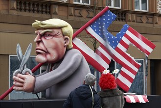 Donald Trump cuts a swastika flag out of the US national flag, danger to democracy, papier-mâché